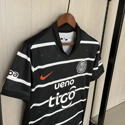Camisola Olimpia Asuncion 2025-26 Alternativa Preta Versão Adepto