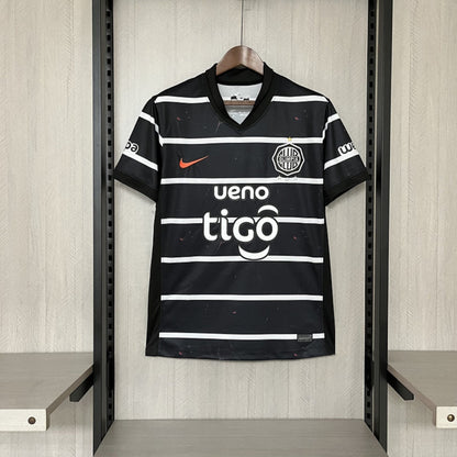 Camisola Olimpia Asuncion 2025-26 Alternativa Preta Versão Adepto