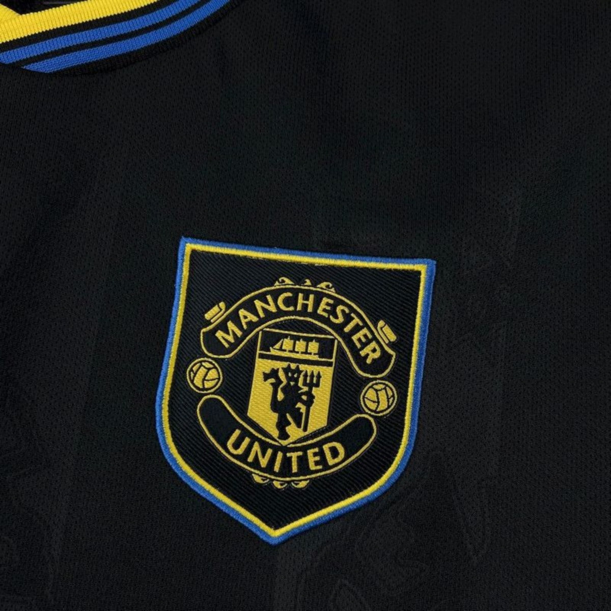 Camisola M-United 2025-26 Alternativa Preta Versão Adepto